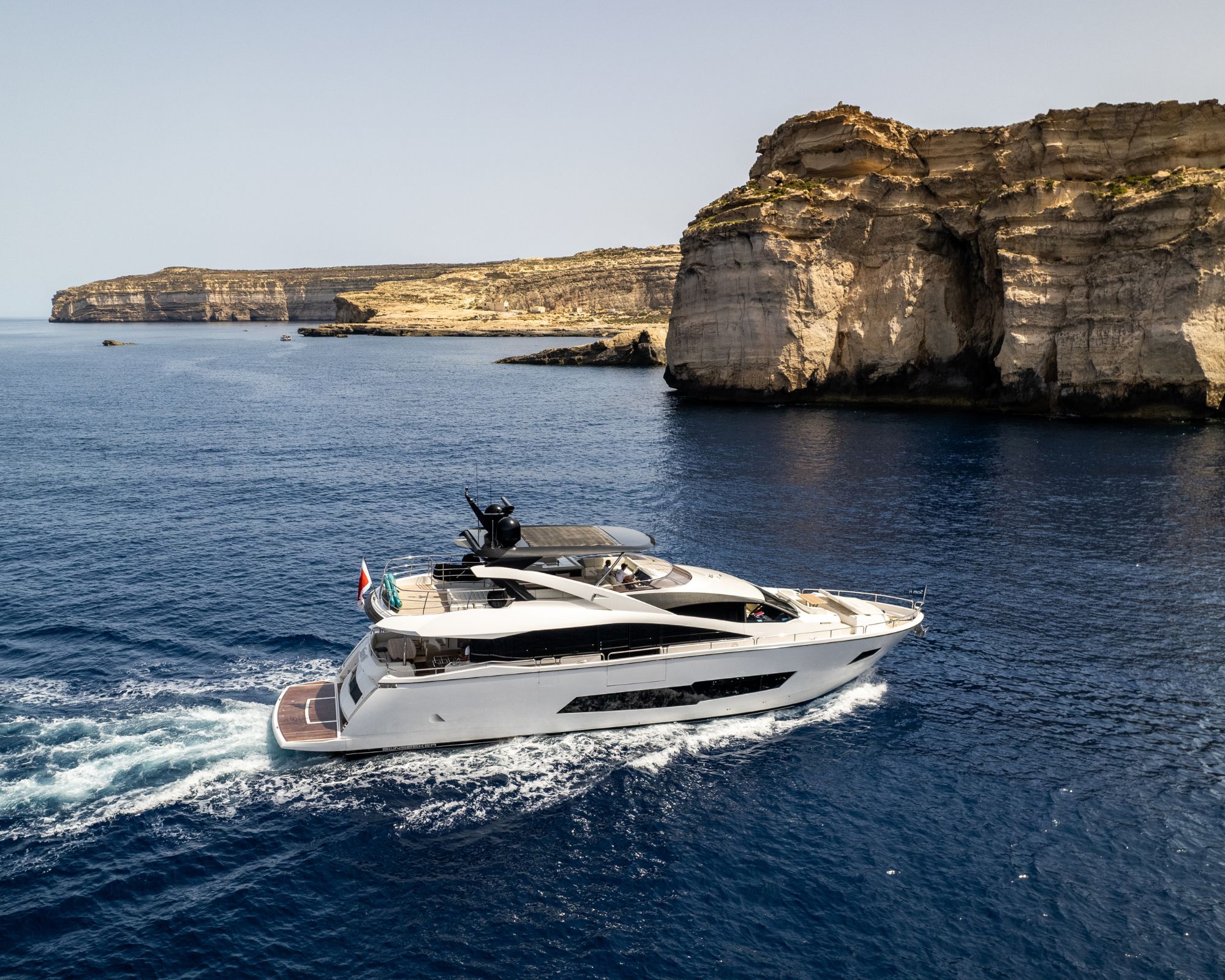 Luxury yacht cruising along the Maltese coastline